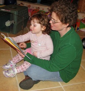 image of adult reading to child